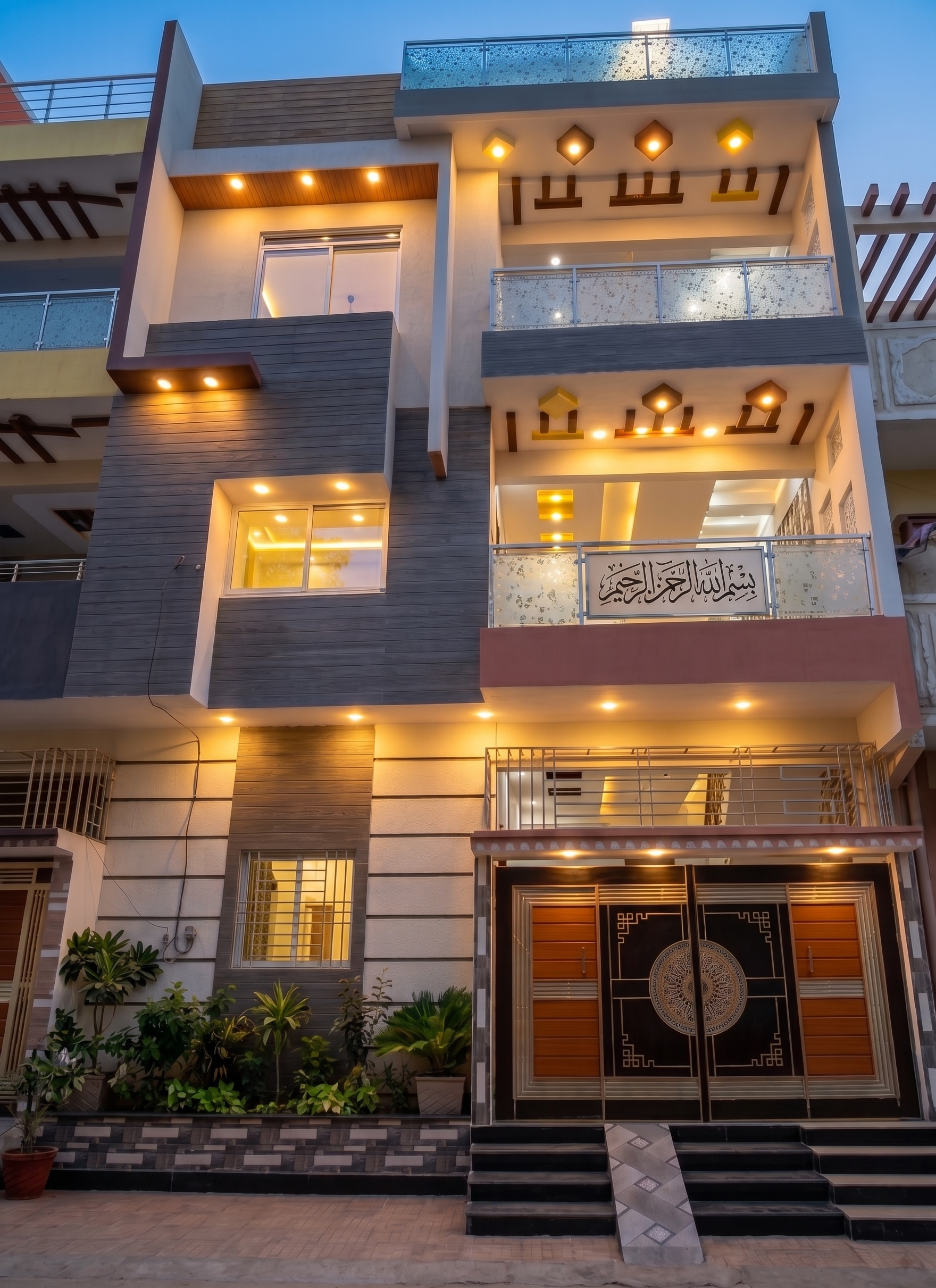 Delivered home in Karachi. Carved gate and layered balcony lighting.